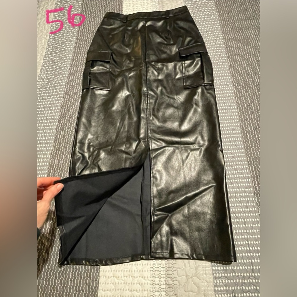 NWOT. Full-length faux black leather cargo skirt.